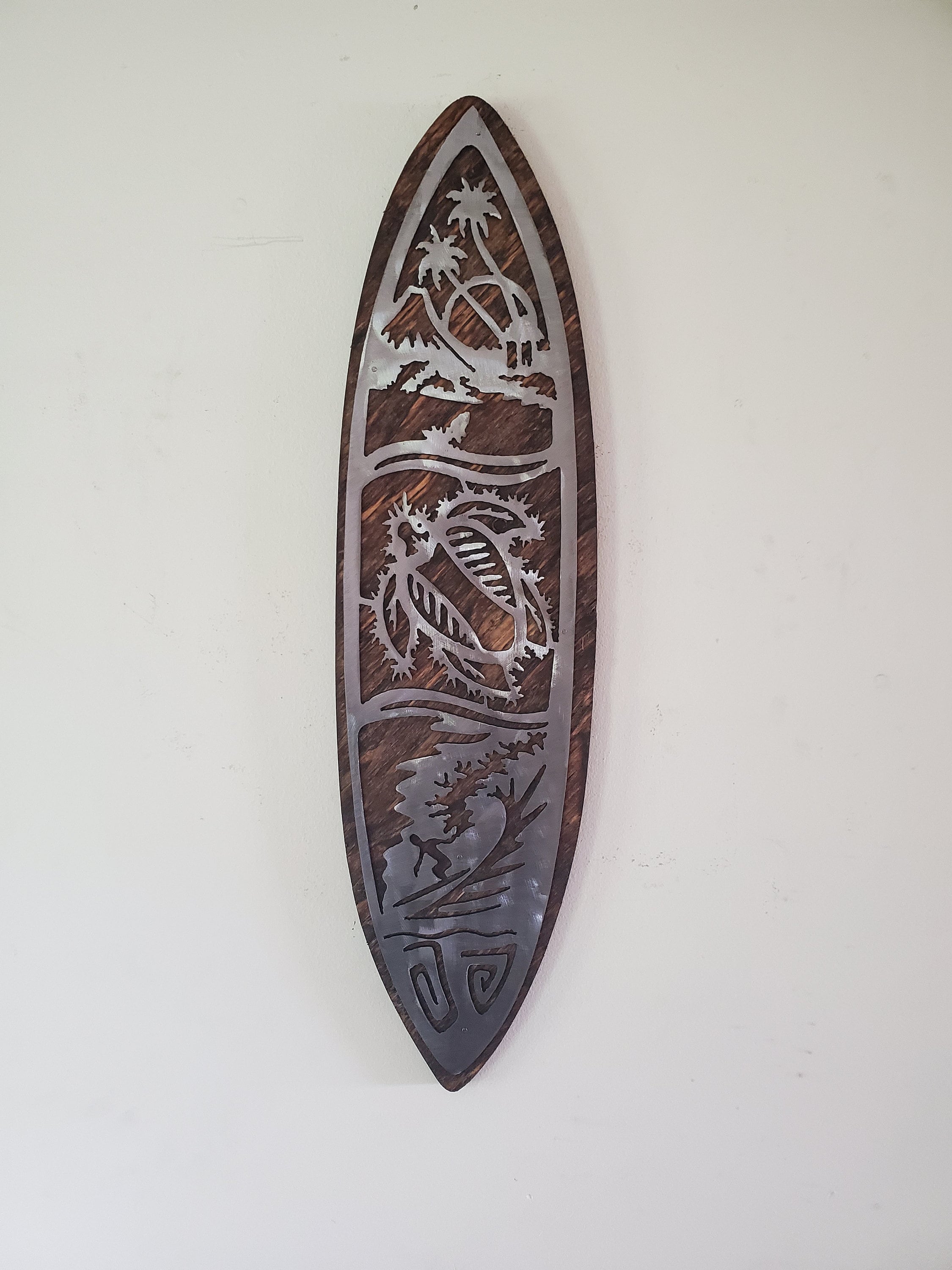 Metal surfboard store wall art